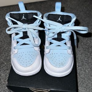Light blue and white Jordans